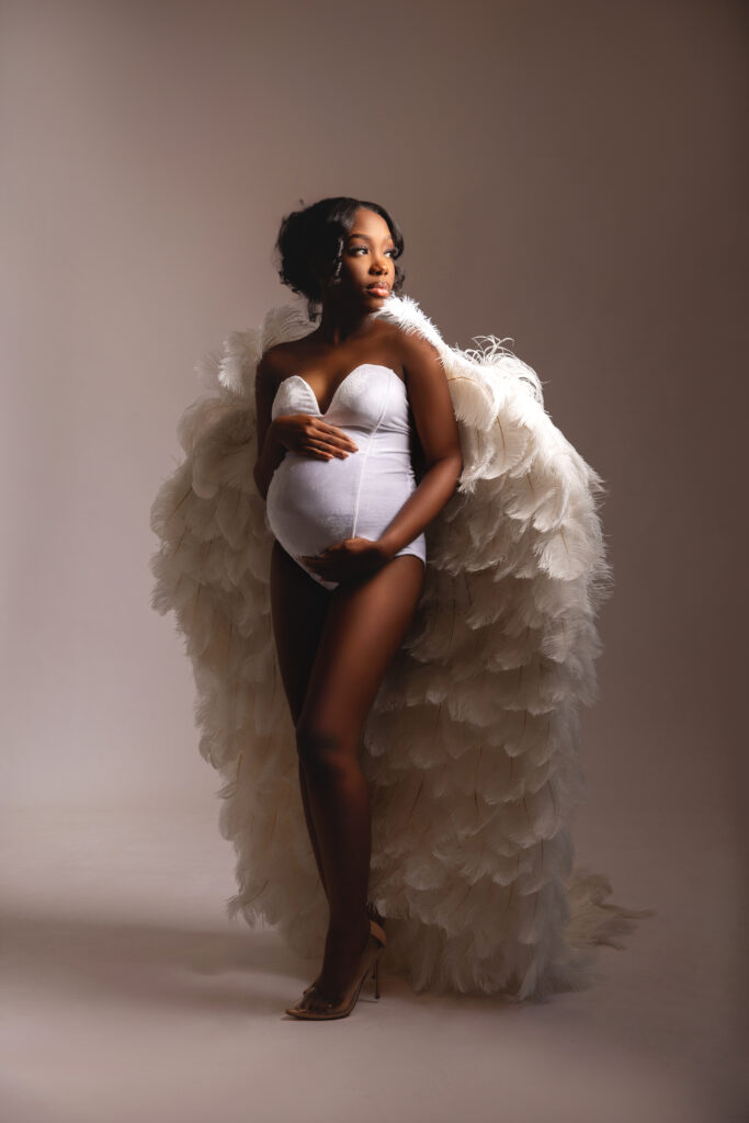 Couple showing joyful expressions during maternity shoot in Chattanooga photography studio.